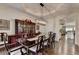 Elegant dining room with hardwood floors, a decorative chandelier, and a view of the kitchen at 2910 Creek Tree Ln, Cumming, GA 30041