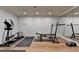 Home gym equipped with exercise machines, weights, and mirrors at 2910 Creek Tree Ln, Cumming, GA 30041
