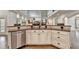 Kitchen features granite countertops, stainless steel appliances, and custom cabinets at 2910 Creek Tree Ln, Cumming, GA 30041