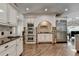 Modern kitchen with granite countertops, stainless steel appliances, and custom cabinets at 2910 Creek Tree Ln, Cumming, GA 30041
