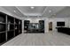 Living room featuring hardwood floors, built-in shelves, and a large entertainment area at 2910 Creek Tree Ln, Cumming, GA 30041