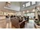 Open-concept living room featuring hardwood floors, high ceilings and large windows at 2910 Creek Tree Ln, Cumming, GA 30041