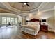 Spacious main bedroom with hardwood floors, a fireplace, and a sitting area at 2910 Creek Tree Ln, Cumming, GA 30041