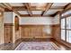 Sophisticated office space with wooden paneling, a decorative rug, and natural light from the windows at 2910 Creek Tree Ln, Cumming, GA 30041