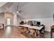 Spacious office area with hardwood floors, ceiling fan, and a door leading outside at 2910 Creek Tree Ln, Cumming, GA 30041