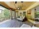 Relaxing porch with ceiling fan and outdoor seating area, offering a tranquil view of lush greenery at 2910 Creek Tree Ln, Cumming, GA 30041