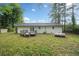 A spacious backyard featuring a wooden deck and green grass at 8535 Hiram Acworth Hwy, Dallas, GA 30157