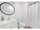Cozy bathroom with updated vanity, round mirror, and shower with curtain at 8535 Hiram Acworth Hwy, Dallas, GA 30157