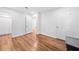 Large bedroom with neutral walls, wood floors, white doors, and ensuite bathroom access at 8535 Hiram Acworth Hwy, Dallas, GA 30157