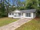 Charming one-story home with covered porch and black window shutters at 8535 Hiram Acworth Hwy, Dallas, GA 30157