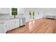 Open kitchen with stainless steel dishwasher, granite counters, tile backsplash, and sliding glass doors at 8535 Hiram Acworth Hwy, Dallas, GA 30157