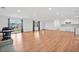 Bright and airy living room featuring hardwood floors, recessed lights, and a view of the kitchen area at 8535 Hiram Acworth Hwy, Dallas, GA 30157