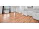 Bright and open living space with hardwood floors connecting the living room, kitchen, and dining areas at 8535 Hiram Acworth Hwy, Dallas, GA 30157