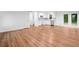 Open concept living space with hardwood floors connecting the living room, kitchen, and dining areas at 8535 Hiram Acworth Hwy, Dallas, GA 30157