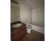 Functional bathroom featuring a single sink vanity, standard toilet, and a combined bathtub and shower at 14104 Fairington Circle Ridge, Stonecrest, GA 30038