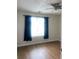 Comfortable bedroom with wood-look floors, a ceiling fan, and natural light at 14104 Fairington Circle Ridge, Stonecrest, GA 30038