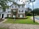 Attractive multi-story apartment building with landscaped grounds and manicured lawn at 14104 Fairington Circle Ridge, Stonecrest, GA 30038