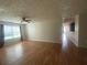 Inviting living room with wood-look floors and plenty of natural light at 14104 Fairington Circle Ridge, Stonecrest, GA 30038