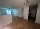 Bright living room with ceiling fan, wood-look flooring, and natural light at 14104 Fairington Circle Ridge, Stonecrest, GA 30038