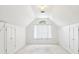 Finished attic with neutral walls, carpet, and storage closets at 3405 Glenrose Trail Trl, Atlanta, GA 30341