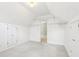 Finished attic with carpet, neutral walls, storage, and view to another room at 3405 Glenrose Trail Trl, Atlanta, GA 30341