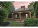 Inviting covered back porch with arched columns, offering a relaxing outdoor living space at 3405 Glenrose Trail Trl, Atlanta, GA 30341