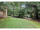 Mature trees and manicured landscaping surround this property with a covered patio at 3405 Glenrose Trail Trl, Atlanta, GA 30341
