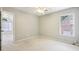 Neutral bedroom with carpet and a window. The space offers a view to another room at 3405 Glenrose Trail Trl, Atlanta, GA 30341