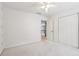 Bedroom with neutral carpet features a ceiling fan and a double door closet at 3405 Glenrose Trail Trl, Atlanta, GA 30341
