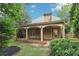 Inviting covered patio perfect for outdoor lounging and entertaining with a view of the private backyard at 3405 Glenrose Trail Trl, Atlanta, GA 30341