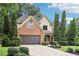 Classic home with mature landscaping, a brick facade, and a spacious driveway at 3405 Glenrose Trail Trl, Atlanta, GA 30341