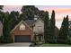 Charming two-story home with brick accents, well-manicured landscaping, and a two-car garage at 3405 Glenrose Trail Trl, Atlanta, GA 30341