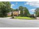 Well-situated home on a corner lot, showcasing manicured lawns and established landscaping at 3405 Glenrose Trail Trl, Atlanta, GA 30341