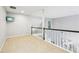 Open hallway with neutral carpet and a large TV on the wall near the stairwell at 3405 Glenrose Trail Trl, Atlanta, GA 30341