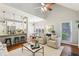 Open concept living room flows into a modern kitchen with a breakfast bar at 3405 Glenrose Trail Trl, Atlanta, GA 30341