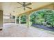 Covered patio with tile flooring features ceiling fans and views of the manicured yard at 3405 Glenrose Trail Trl, Atlanta, GA 30341