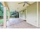 Covered patio with tile flooring features multiple ceiling fans and views of the fenced yard at 3405 Glenrose Trail Trl, Atlanta, GA 30341