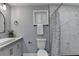 Stylish bathroom featuring white marble shower, toilet, and vanity at 737 Bolton Nw Rd, Atlanta, GA 30331