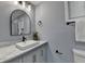 Elegant bathroom with gray vanity, a modern mirror, and neutral accents at 737 Bolton Nw Rd, Atlanta, GA 30331