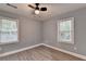 Bedroom featuring two windows and a ceiling fan at 737 Bolton Nw Rd, Atlanta, GA 30331