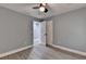 Bedroom with a ceiling fan features wood-look flooring and white trim at 737 Bolton Nw Rd, Atlanta, GA 30331