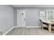 Dining room with light gray walls, light vinyl floors, and new windows at 737 Bolton Nw Rd, Atlanta, GA 30331