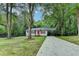 Charming renovated home with an orange front door, cedar shutters, and a long driveway at 737 Bolton Nw Rd, Atlanta, GA 30331