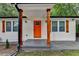 Close up of front porch with orange door, cedar posts, and address at 737 Bolton Nw Rd, Atlanta, GA 30331