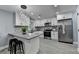 Modern kitchen features white cabinets, stainless steel appliances, and stylish countertops at 737 Bolton Nw Rd, Atlanta, GA 30331