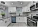 Updated kitchen features modern appliances, gray countertops, and white cabinets at 737 Bolton Nw Rd, Atlanta, GA 30331