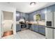 Stylish kitchen with stainless steel appliances and painted cabinets with butcher block countertops at 240 Wellington Dr, Mcdonough, GA 30252
