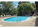 Refreshing community pool with lounge chairs and umbrellas, perfect for summer relaxation at 3210 Lake Pointe Cir, Roswell, GA 30075