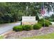 Attractive community sign with lush landscaping, showcasing the entrance to Roswell Pointe at 3210 Lake Pointe Cir, Roswell, GA 30075