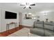 Open concept living room with hardwood floors and views into kitchen and dining area at 3210 Lake Pointe Cir, Roswell, GA 30075